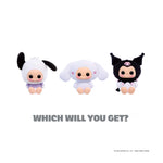 Three Hello Kitty character figurines with different outfits on a white background.