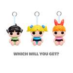 Three cartoon-style character keychains with different hairstyles and outfits on a white background.