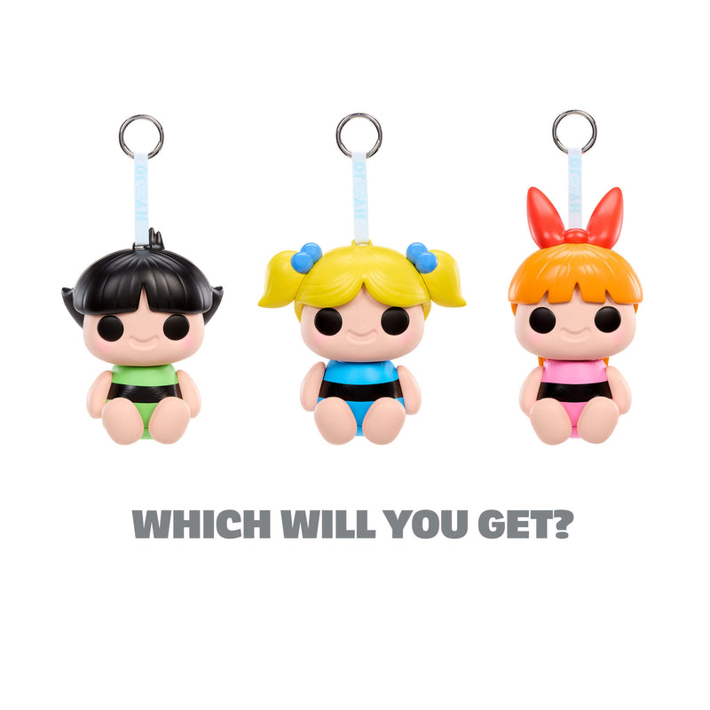 Three cartoon-style character keychains with different hairstyles and outfits on a white background.