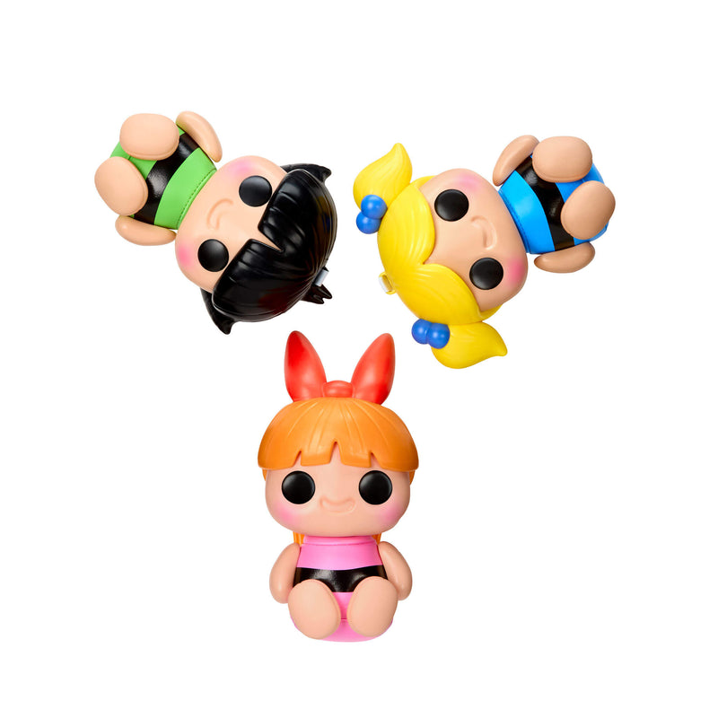 Three colorful figurines with different hairstyles on a white background