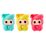 Three squishy Gummy Bears, blue on the left, yellow in the center and pink on the right, on a white background.