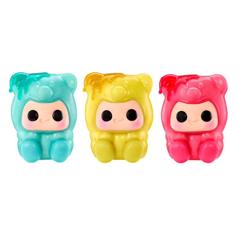 Three squishy Gummy Bears, blue on the left, yellow in the center and pink on the right, on a white background.