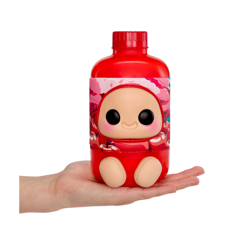 Red bottle sitting in the palm of a hand on a white background