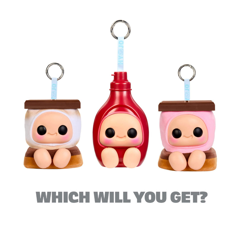 Three HERSHEY keychains; left half a smore with white marshmallow, middle red bottle and the right side a smore with pink marshmallow with text below ‘WHICH WILL YOU GET?’
