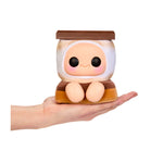 Smore-themed plush, with big black eyes, Rosy cheeks, a smile and feet being held in the palm of a hand, on a white background