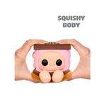 Hands-holding toy shaped like a smore with pink middle, featuring a cute cartoon face on the front, with feet, shown against a plain white background. ‘SQUISHY BODY’ in upper right hand corner.