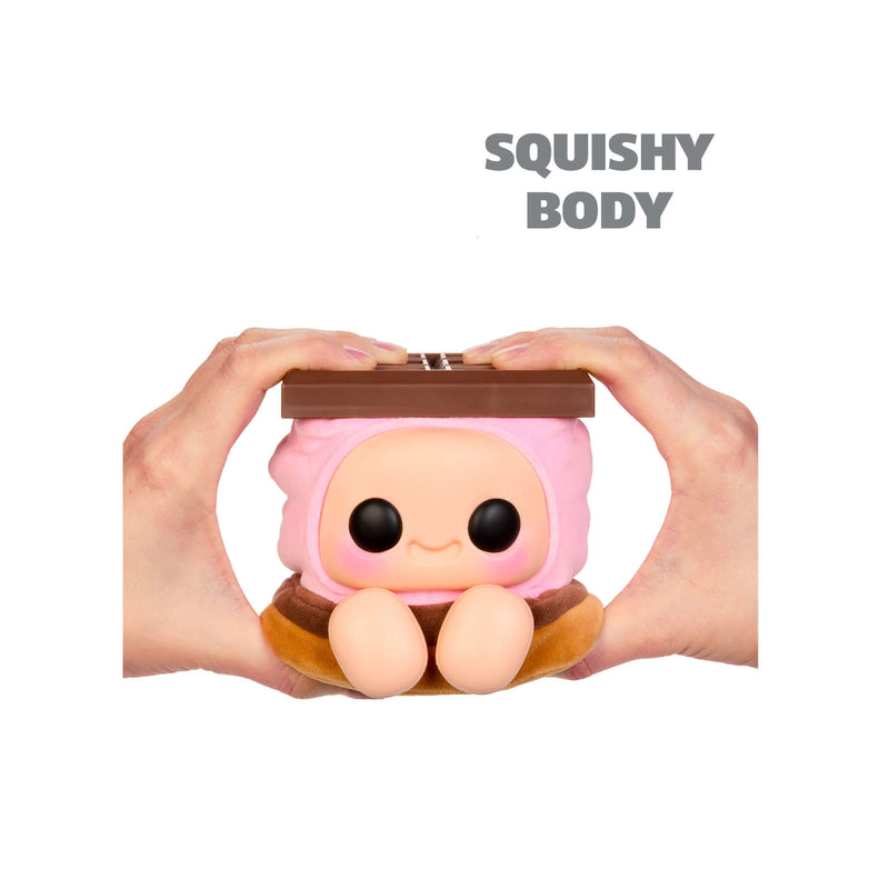 Hands-holding toy shaped like a smore with pink middle, featuring a cute cartoon face on the front, with feet, shown against a plain white background. ‘SQUISHY BODY’ in upper right hand corner.
