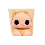 A cute, stylized vinyl figure of a character with large black eyes, pink cheeks, and a small pink tongue, set against a solid white background.