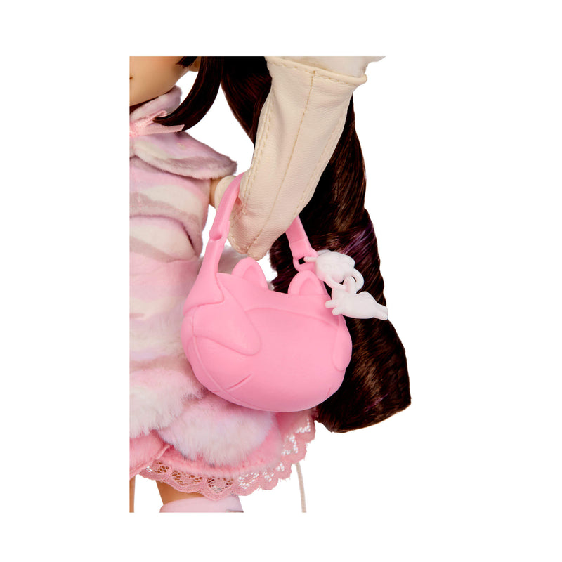 A pink cat-shaped handbag with a white charm, shown being carried by a doll wearing a pink and white outfit against a white background.