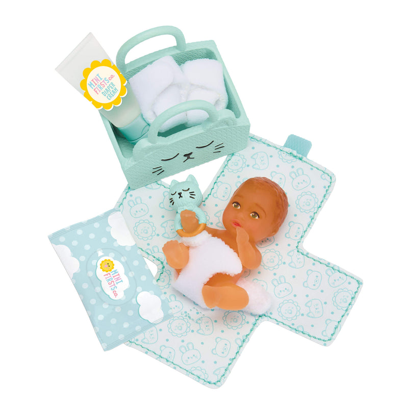 Mini baby ready for a diaper change on a white background
