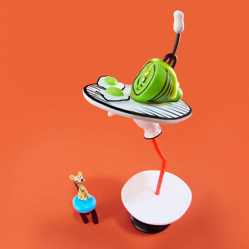 A whimsical tabletop miniature scene on a solid orange background. The main subject is a stylized green ham on a white plate, balanced on a white hand.