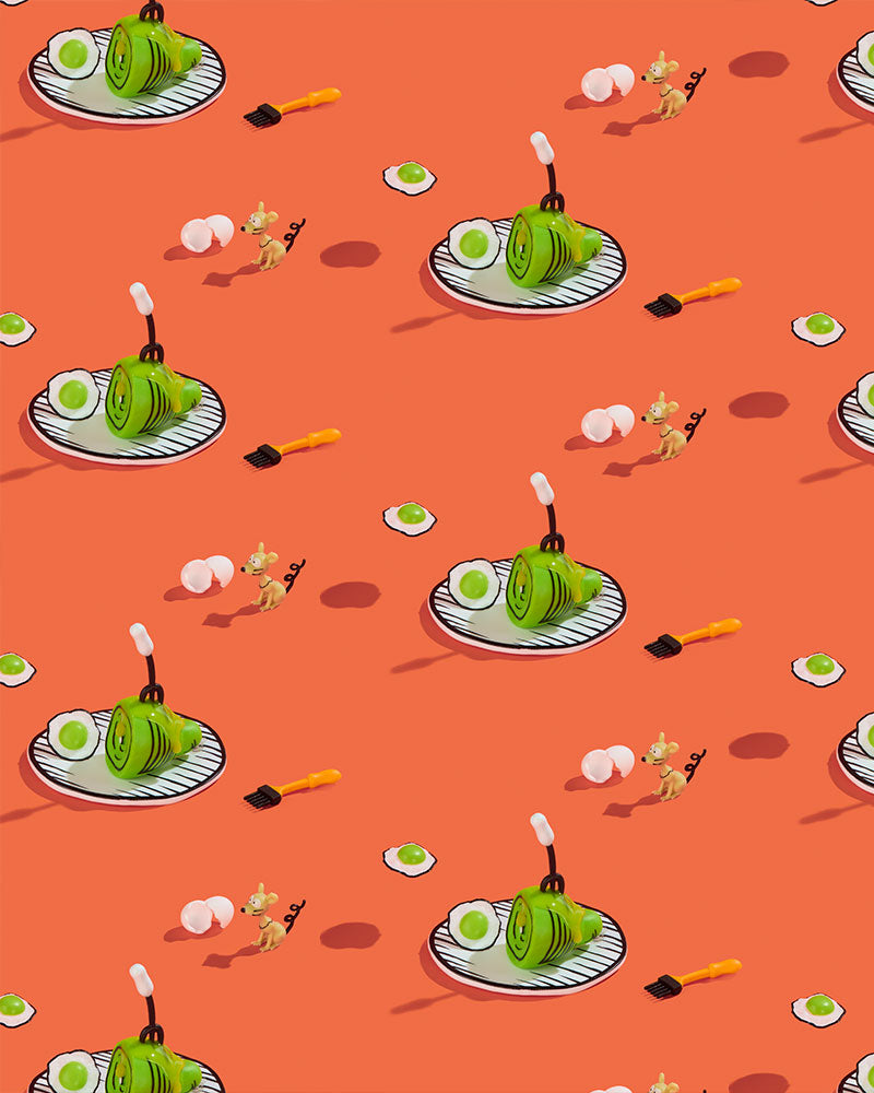 A repeating pattern on a solid orange background featuring GREEN EGGS AND HAM BY DR. SEUSS on white plates with black handles, small white eggs, and yellow-handled tools.