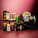 Collection of 'Liquid Death' products including cans, a box, and a large sphere with branding on a red background.