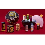 Collection of 'Liquid Death' products including bottles, boxes, and a balloon on a red background