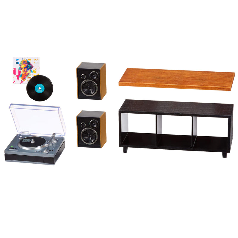 Set of mini furniture items including a record player, speakers, and shelves on a white background