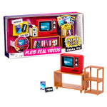 Mini Verse Real TV set featuring a red television on a wooden stand, a matching shelving unit, and several toy VHS tapes, shown both inside its retail packaging and as a standalone product arrangement on a white background.