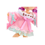 Close up of the dolls pink sweater dress, with mint green ruffles, white collar with a cats face.