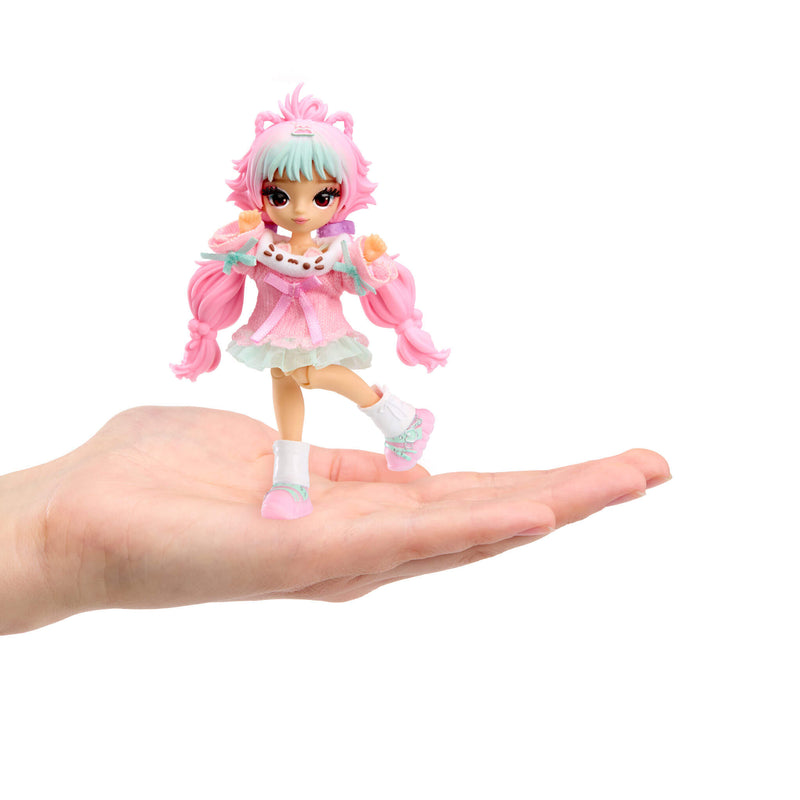 Mirror Mi Mini Mi doll standing in the palm of a hand.