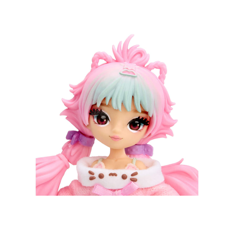 Head shot of doll with brown eyes, blue and pink hair on a white background