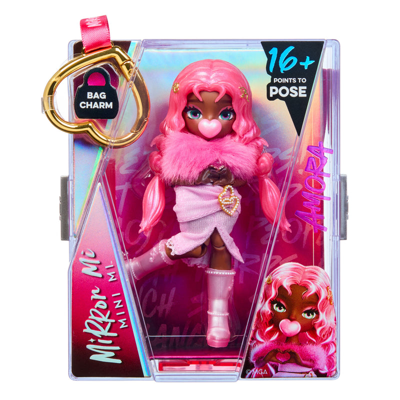 Mirror Mi Mini Mi doll with long pink hair, a pink dress, and pink accessories, shown inside its retail packaging on a white background.