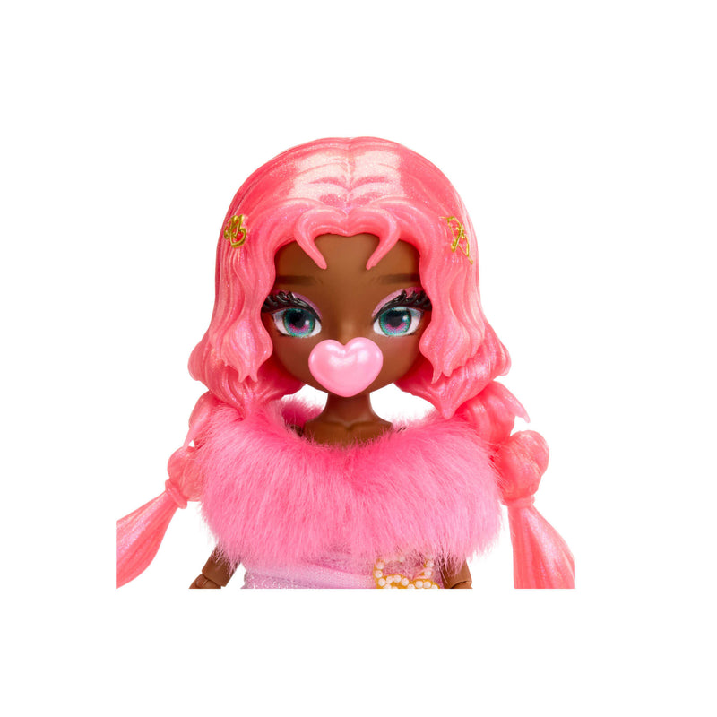A close-up of the dolls pink hair, bright eyes, pink heart bubble, fuzzy dress top on a white background.