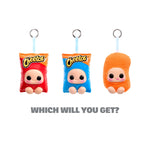 Three cartoon-style character keychains with different faces on a white background