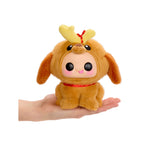 Max, with big black eyes, tongue hanging out, in a reindeer outfit, being held in the palm of a hand, on a white background