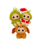 Three-character plush toys: Grinch Santa and The Grinch sitting on Max’s head on a white background. 