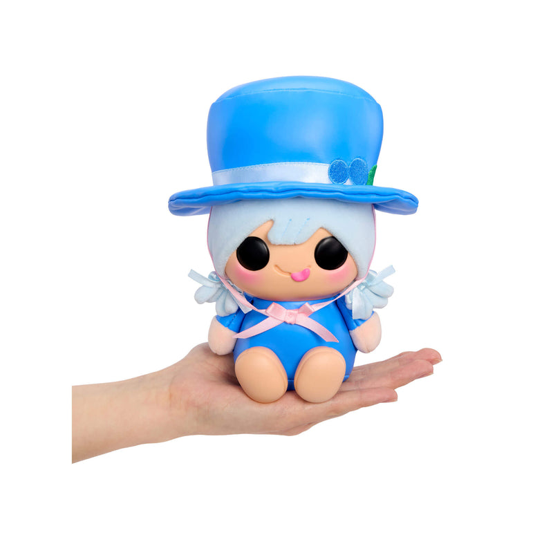 A small character doll with a matching blue top hat, light blue hair, and a pink bow, resting on a person's hand against a plain white background.