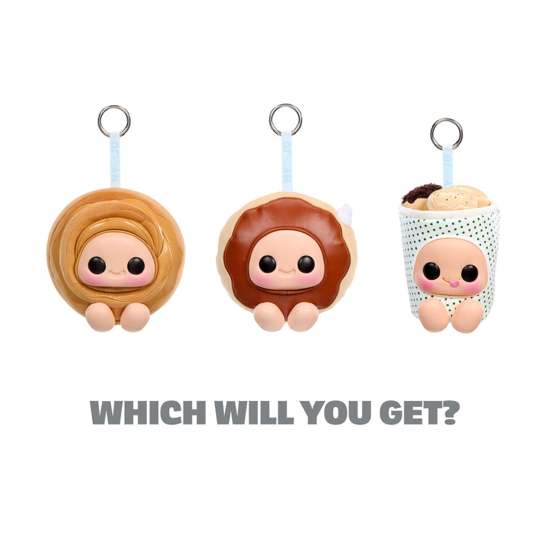 Three cartoon-style keychains shaped like donuts with faces on a white background.