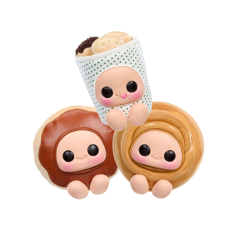 Three cute donut-shaped figurines with faces on a white background