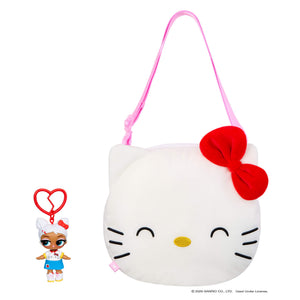 Doll keychain next to a white cat bag with red bow on a white background