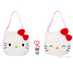 Two white, catlike bags, with eyes open one eyes closed with keychain on a white background
