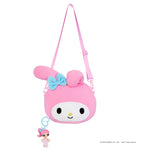Key chain hanging from bottom of bag on a white background