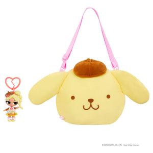 Doll keychain next to a Yellow dog bag with a brown hat on a white background