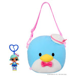 Doll keychain next to a blue penguin like bag with sailor hat on a white background