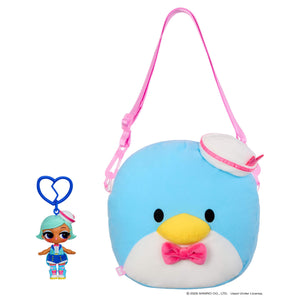 Doll keychain next to a blue penguin like bag with sailor hat on a white background