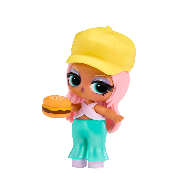 Tot doll with pink hair wearing a yellow baseball hat, pink top, blue pants holding a hamburger on a white background
