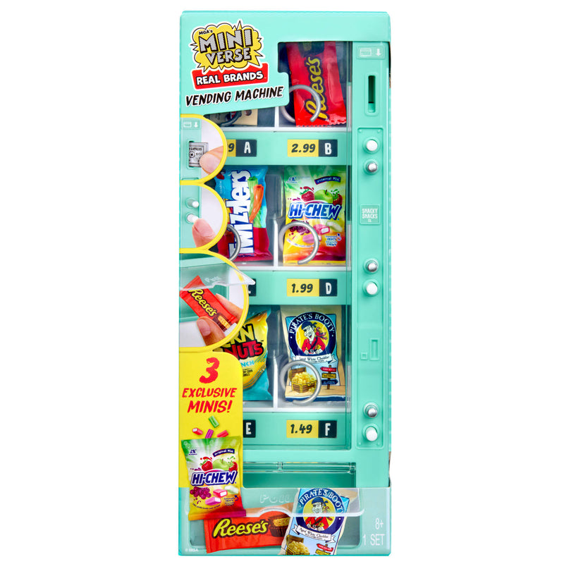 Miniature vending machine with various candy packages on a white background