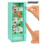 Toy teal vending machine with snacks and a hand pressing the 'Dispense!' button.
