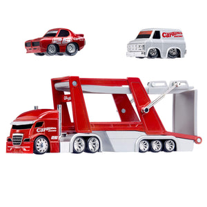 Red and grey toy semi car hauler with two smaller toy cars, one red, one grey on a white background.