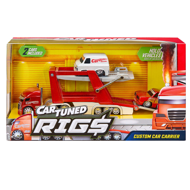 Packaging with red and grey toy semi car hauler with two smaller toy cars. Upper left states ‘2 CARS INCLUDED’ bottom right states ‘CUSTOM CAR CARRIER’ with ‘CARTUNED RIG$’ logo.