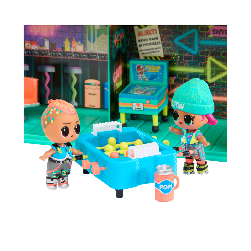 Two toy figures with a foosball table in a colorful room setting.