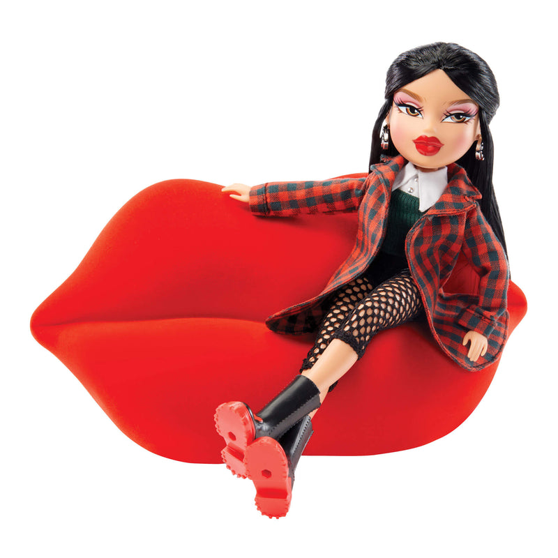 doll sitting on lip couch