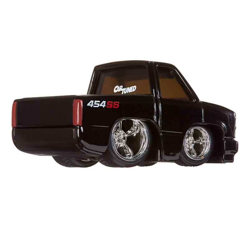 Black toy truck with chrome wheels on a white background