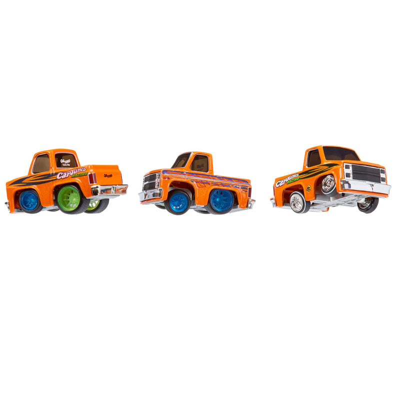Three trucks showing the different colors that rims can be made. Blue - Green or chrome looking