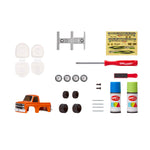 Collection of car parts including a  orange truck, tools, and paint cans on a white background