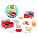 Miniature kitchen set with toy fryer, ingredients, and packaging on a white background