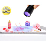 UV light being used on a small table with various items including a bottle, a mold and a container.