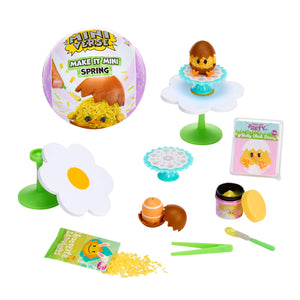 Miniature spring-themed set with figurines and accessories on a white background